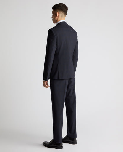 Man wearing a navy Slim Fit Checked Stretch Suit