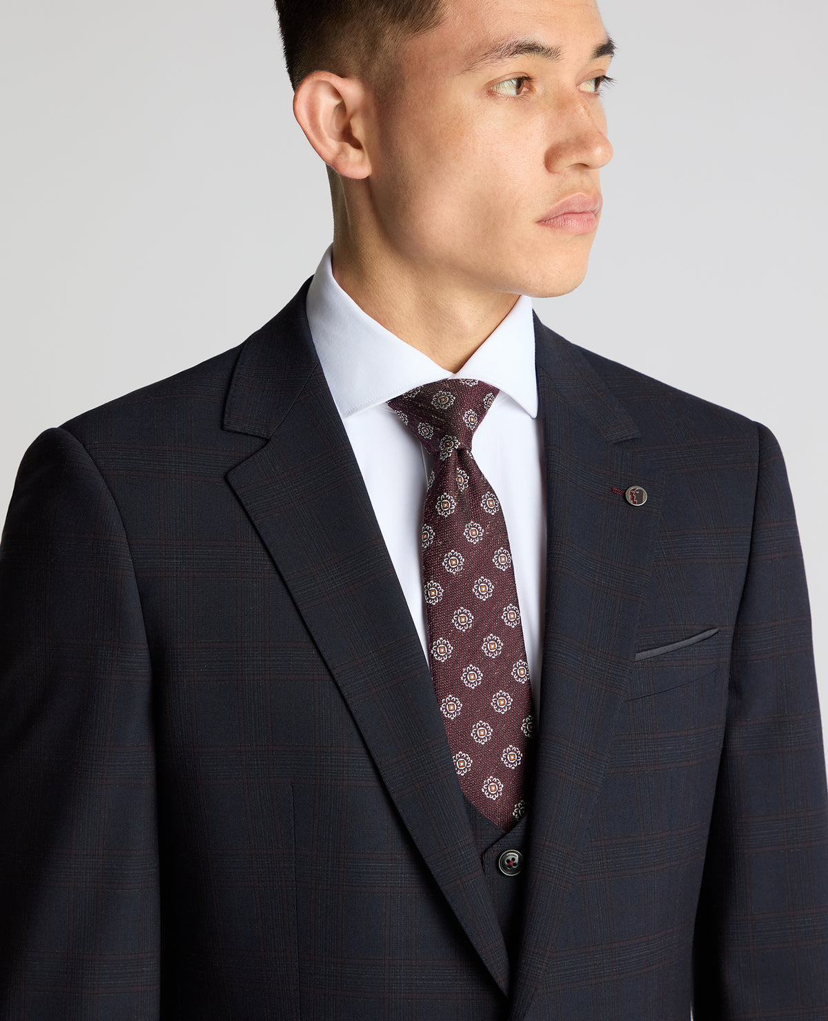Man wearing a navy Slim Fit Checked Stretch Suit