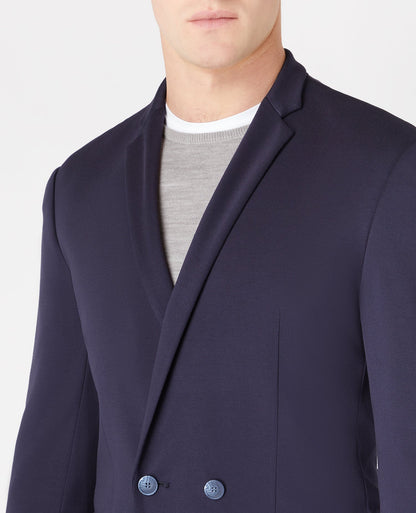 Man wearing a navy Slim Fit Double Breasted Stretch Jersey Jacket