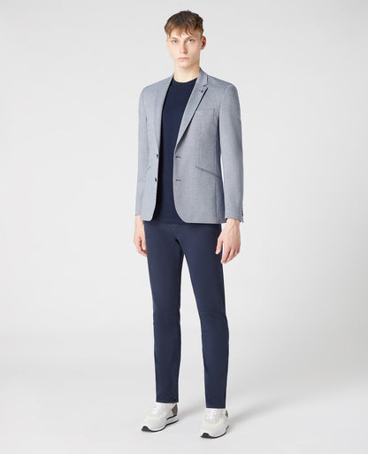 Man wearing a blue Tapered-Fit Stretch Jacket