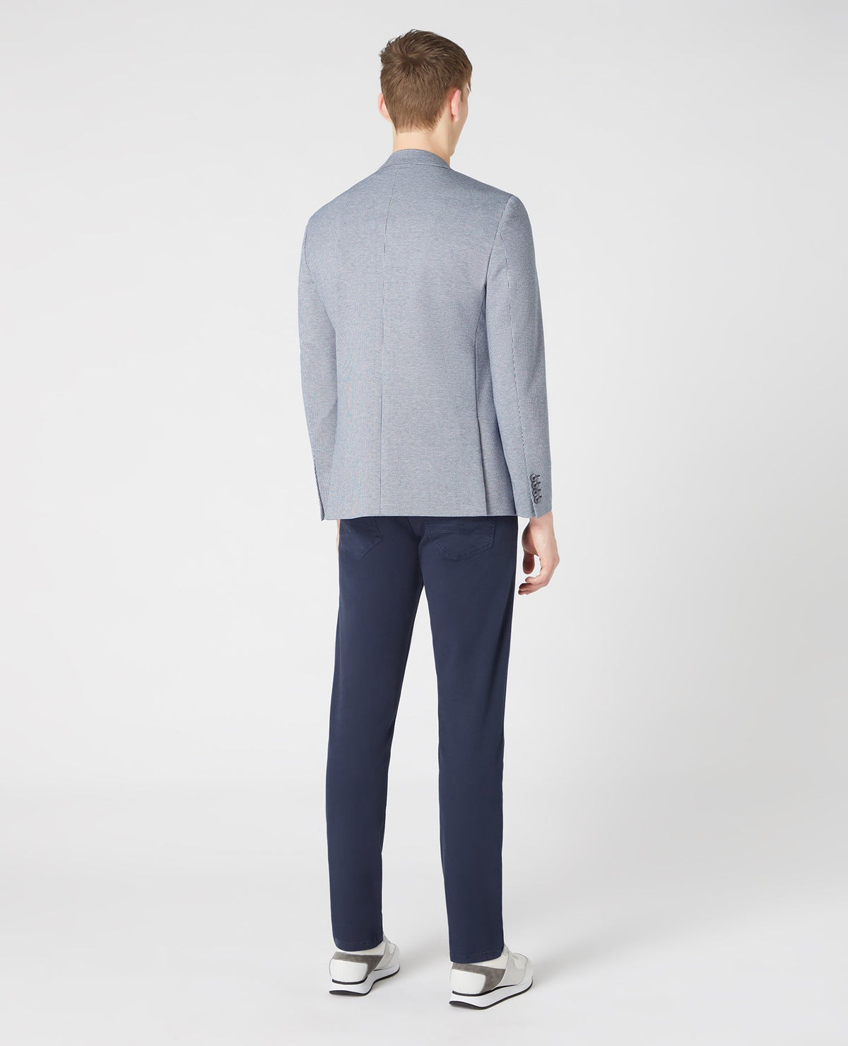 Man wearing a blue Tapered-Fit Stretch Jacket
