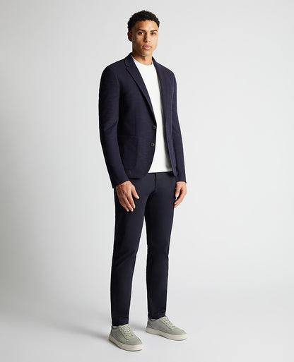 Man wearing a navy Slim Fit Cotton-Blend Stretch Jacket