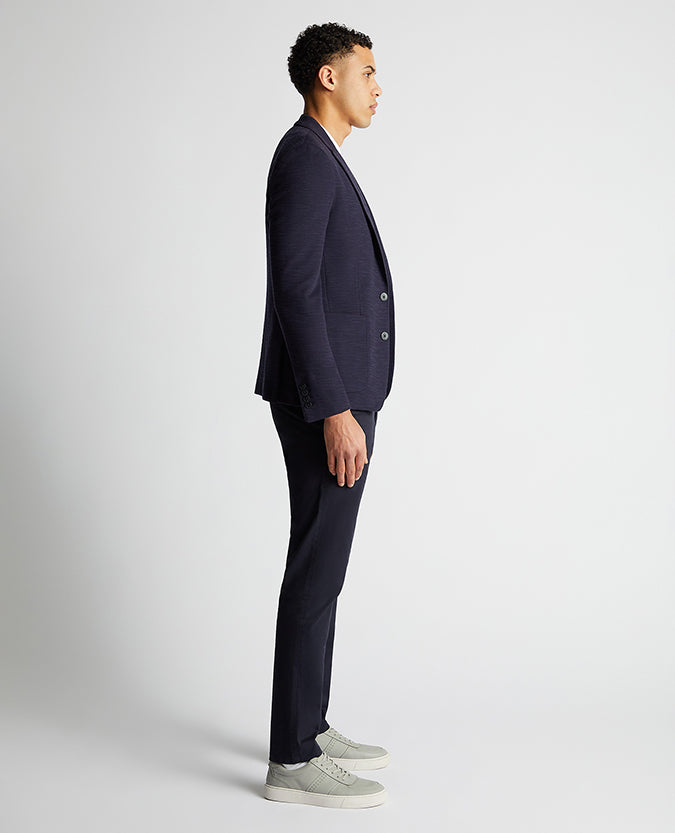 Man wearing a navy Slim Fit Cotton-Blend Stretch Jacket