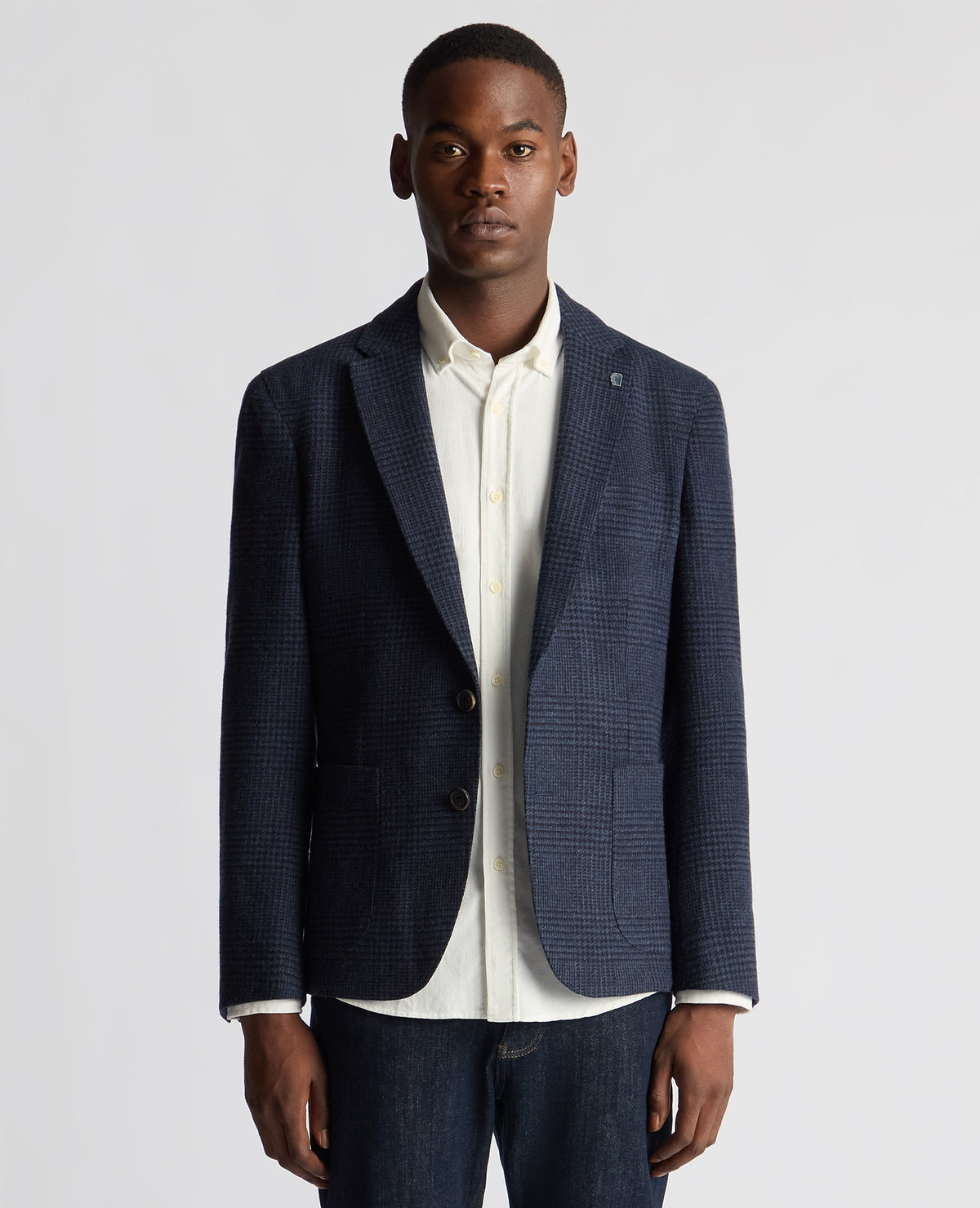 Man wearing a navy Slim Fit Checked Wool Jacket