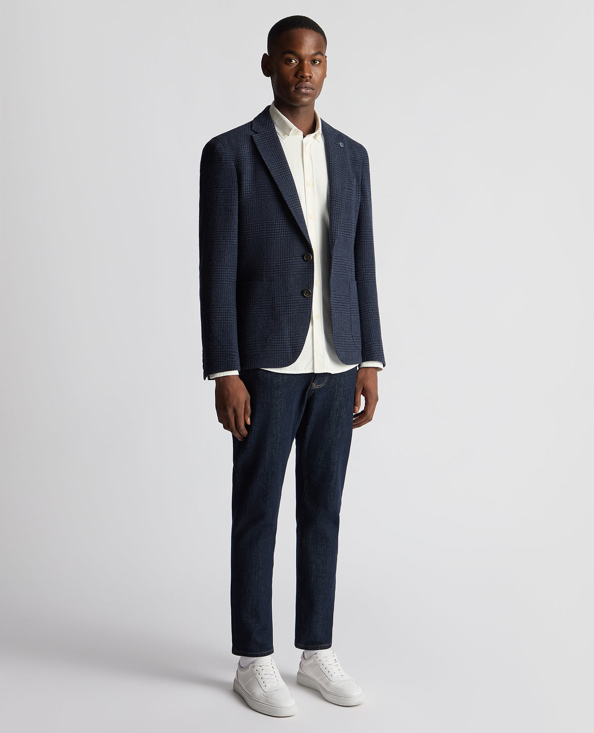 Man wearing a navy Slim Fit Checked Wool Jacket