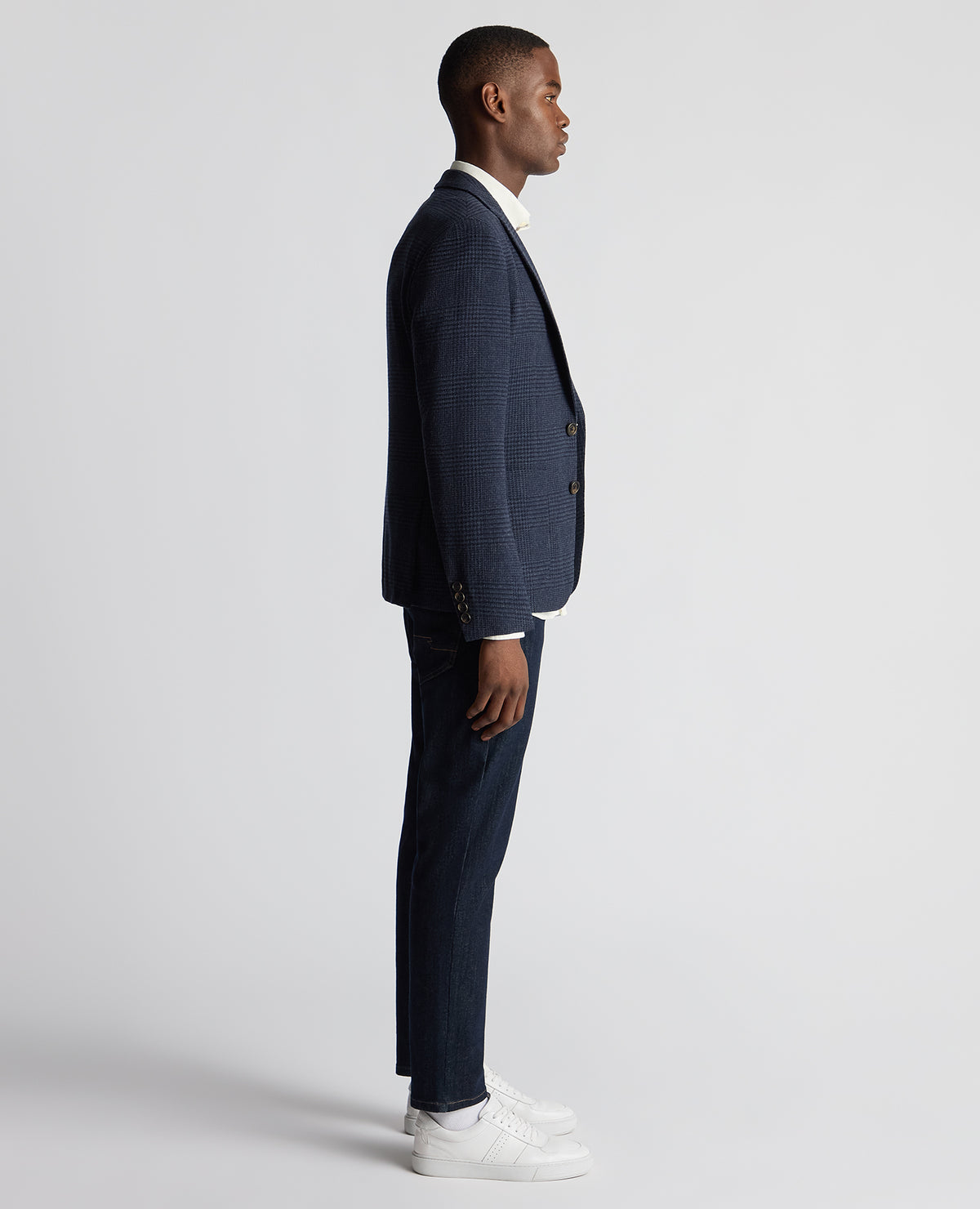 Man wearing a navy Slim Fit Checked Wool Jacket