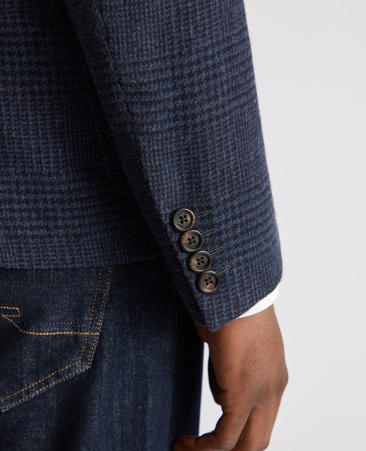 Man wearing a navy Slim Fit Checked Wool Jacket