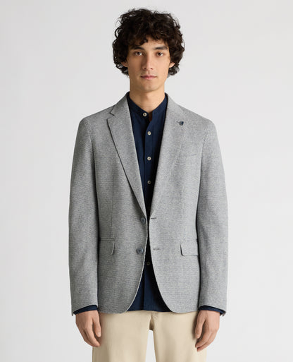 Man wearing a blue Slim Fit Cotton-Blend Stretch Jacket