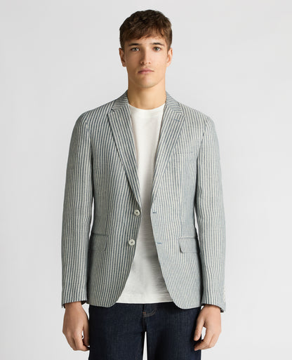 Man wearing a navy Slim Fit Linen-Blend Pinstripe Jacket