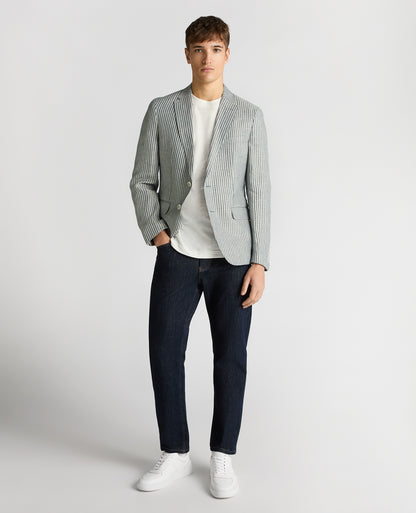 Man wearing a navy Slim Fit Linen-Blend Pinstripe Jacket