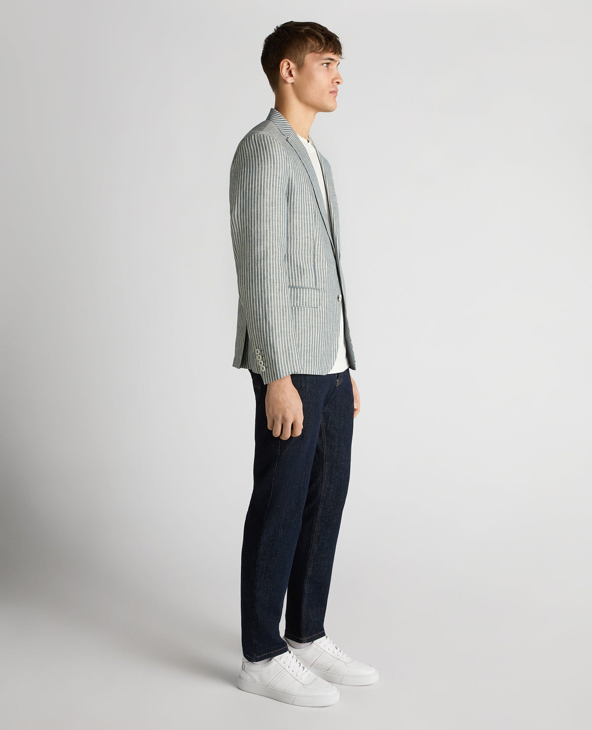 Man wearing a navy Slim Fit Linen-Blend Pinstripe Jacket