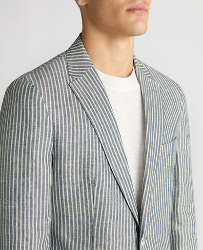 Man wearing a navy Slim Fit Linen-Blend Pinstripe Jacket