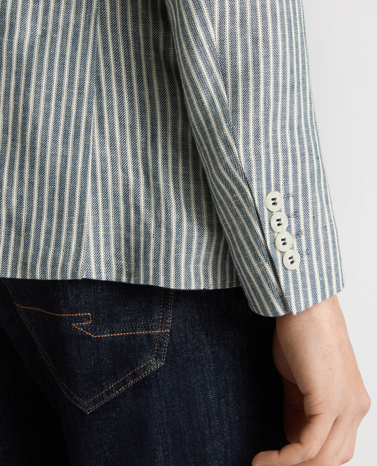 Man wearing a navy Slim Fit Linen-Blend Pinstripe Jacket