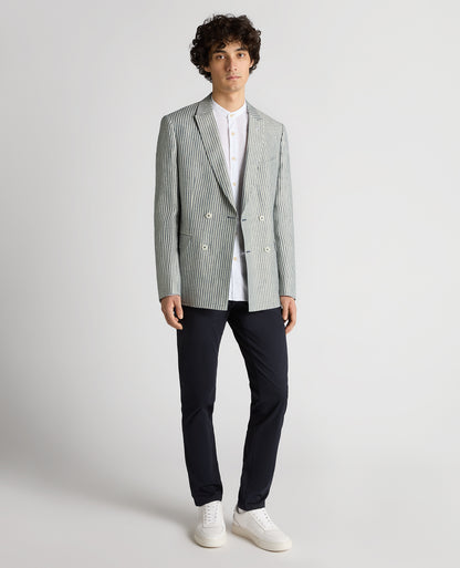 Man wearing a navy Slim Fit Linen-Blend Double-Breasted Pinstripe Jacket