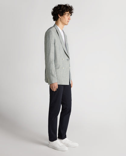 Man wearing a navy Slim Fit Linen-Blend Double-Breasted Pinstripe Jacket