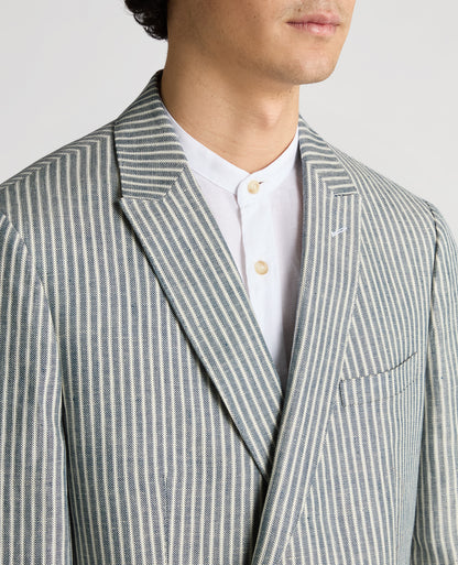 Man wearing a navy Slim Fit Linen-Blend Double-Breasted Pinstripe Jacket