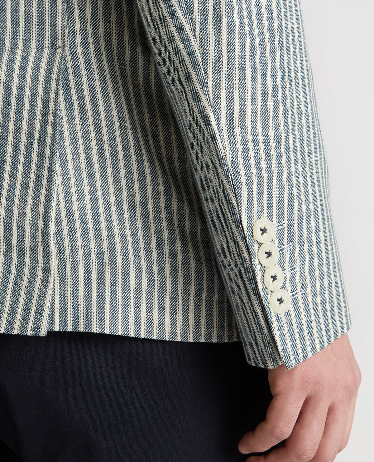 Man wearing a navy Slim Fit Linen-Blend Double-Breasted Pinstripe Jacket