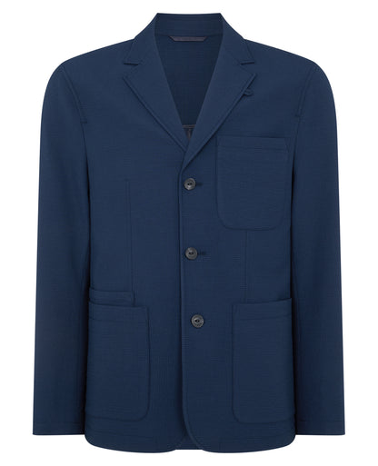 Man wearing a blue Slim Fit Seersucker De-Constructed Jacket