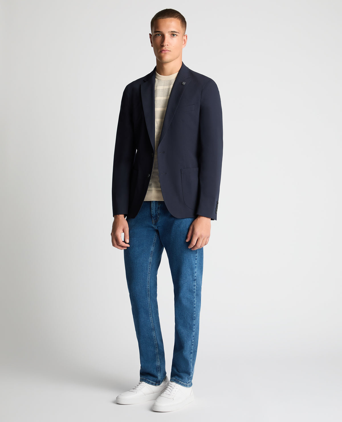 Man wearing a navy Slim Fit Stretch Jacket