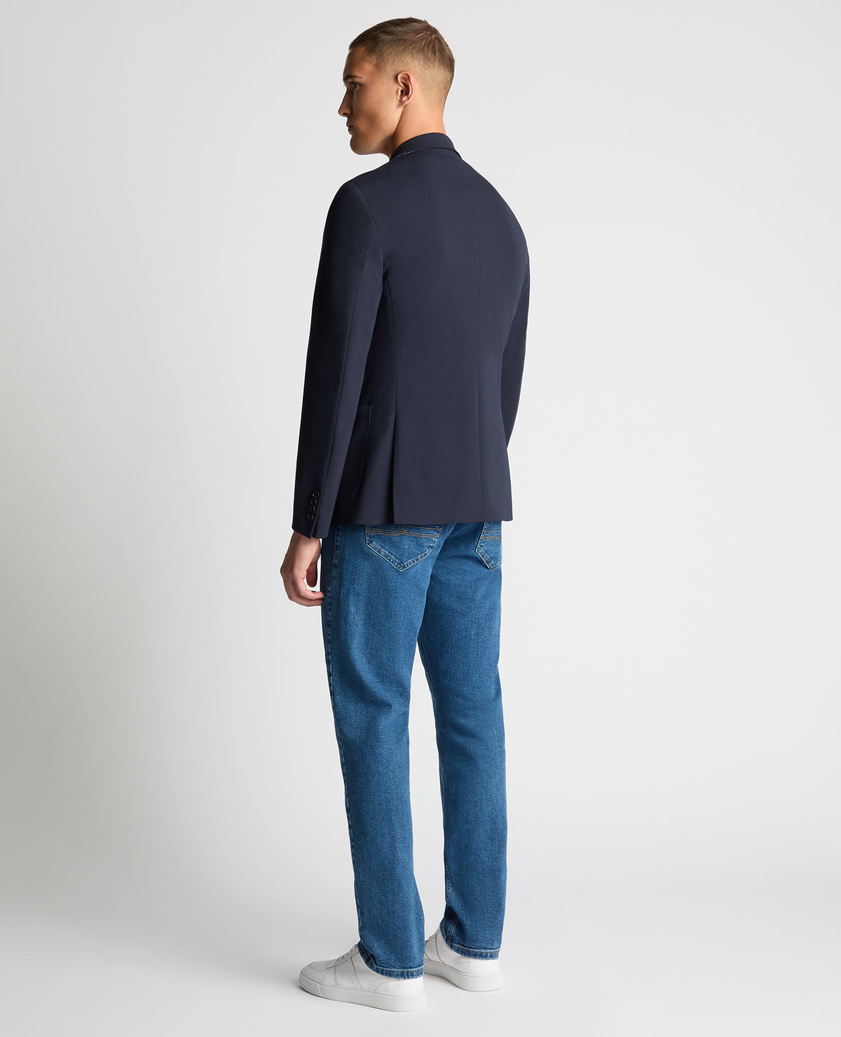 Man wearing a navy Slim Fit Stretch Jacket