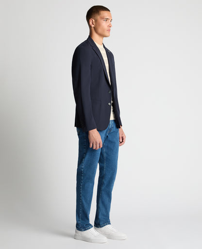 Man wearing a navy Slim Fit Stretch Jacket