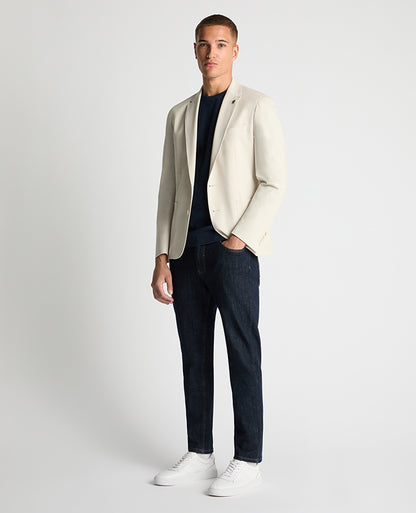 Man wearing a sand Slim Fit Stretch Jacket