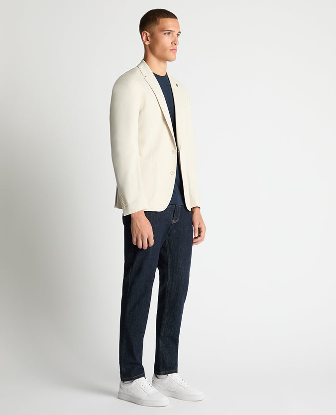 Man wearing a sand Slim Fit Stretch Jacket