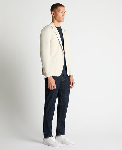 Man wearing a sand Slim Fit Stretch Jacket