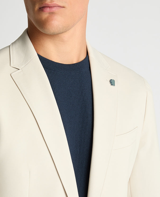 Man wearing a sand Slim Fit Stretch Jacket
