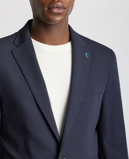 Man wearing a navy Tapered Fit Stretch Jacket