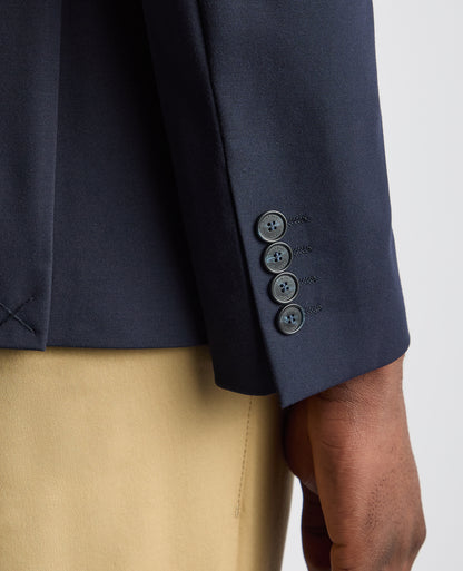 Man wearing a navy Tapered Fit Stretch Jacket