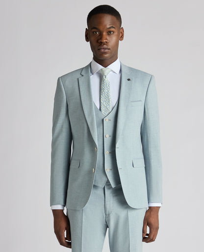 Man wearing a blue Slim Fit Linen-Blend Micro Pinstripe Suit Jacket