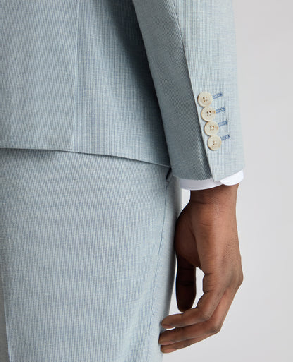 Man wearing a blue Slim Fit Linen-Blend Pinstripe Suit