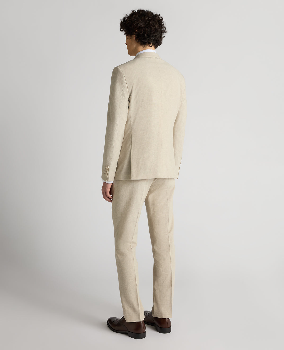 Man wearing a sand Slim Fit Linen-Blend Micro Pinstripe Suit Jacket