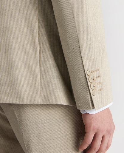 Man wearing a sand Slim Fit Linen-Blend Micro Pinstripe Suit Jacket