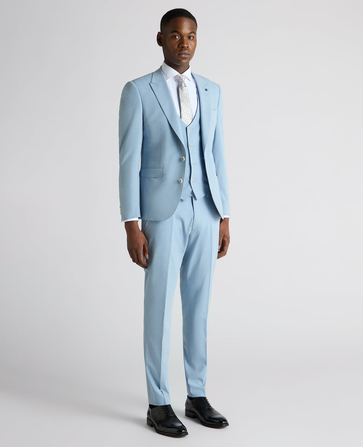Man wearing a blue Slim Fit Stretch Suit Jacket