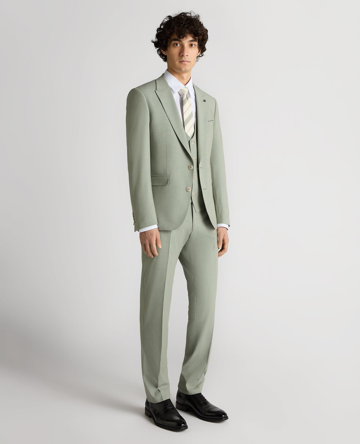 Man wearing a green Slim Fit Stretch Suit Jacket