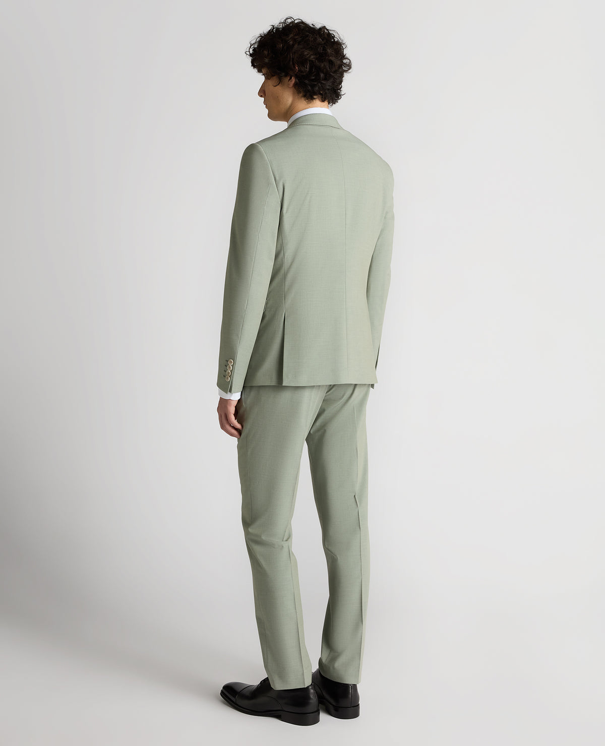 Man wearing a green Slim Fit Stretch Suit Jacket
