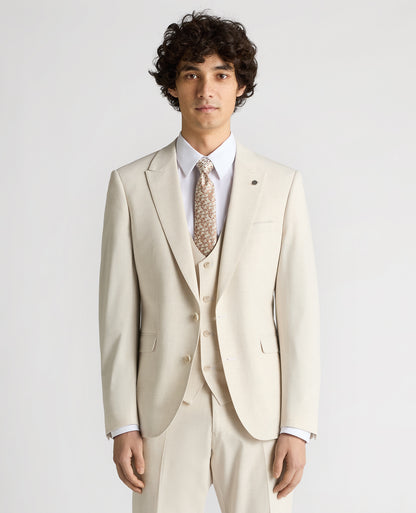 Man wearing a sand Slim Fit Stretch Suit