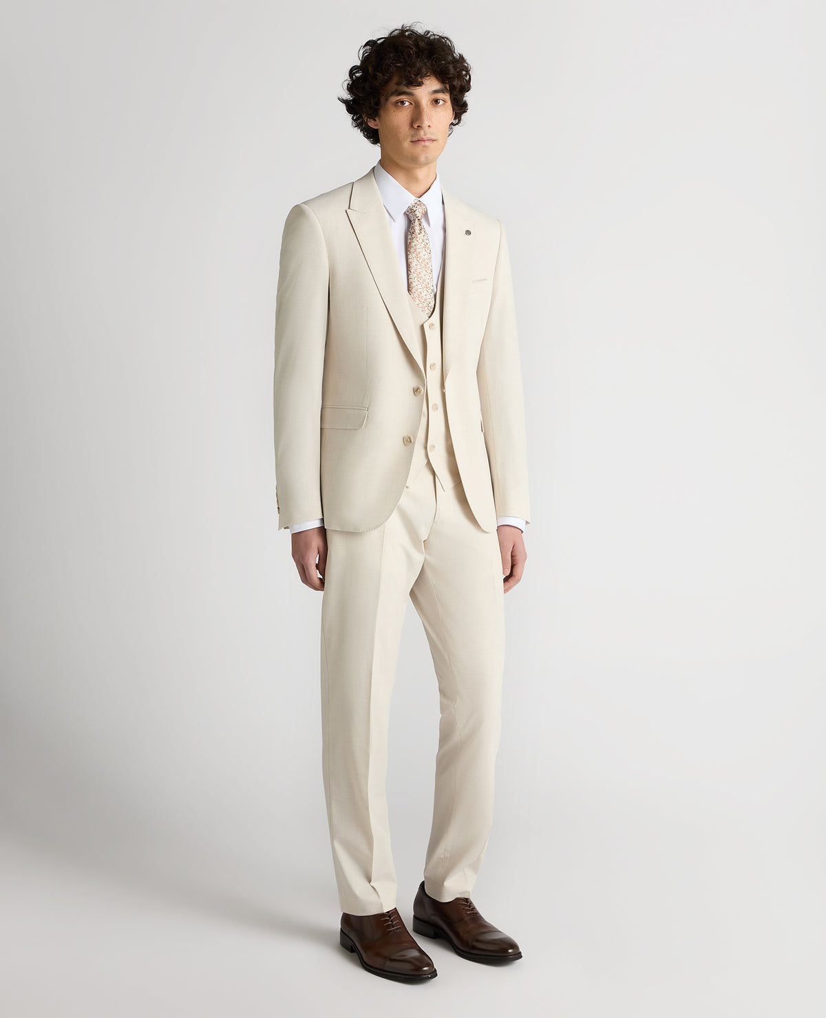 Man wearing a sand Slim Fit Stretch Suit
