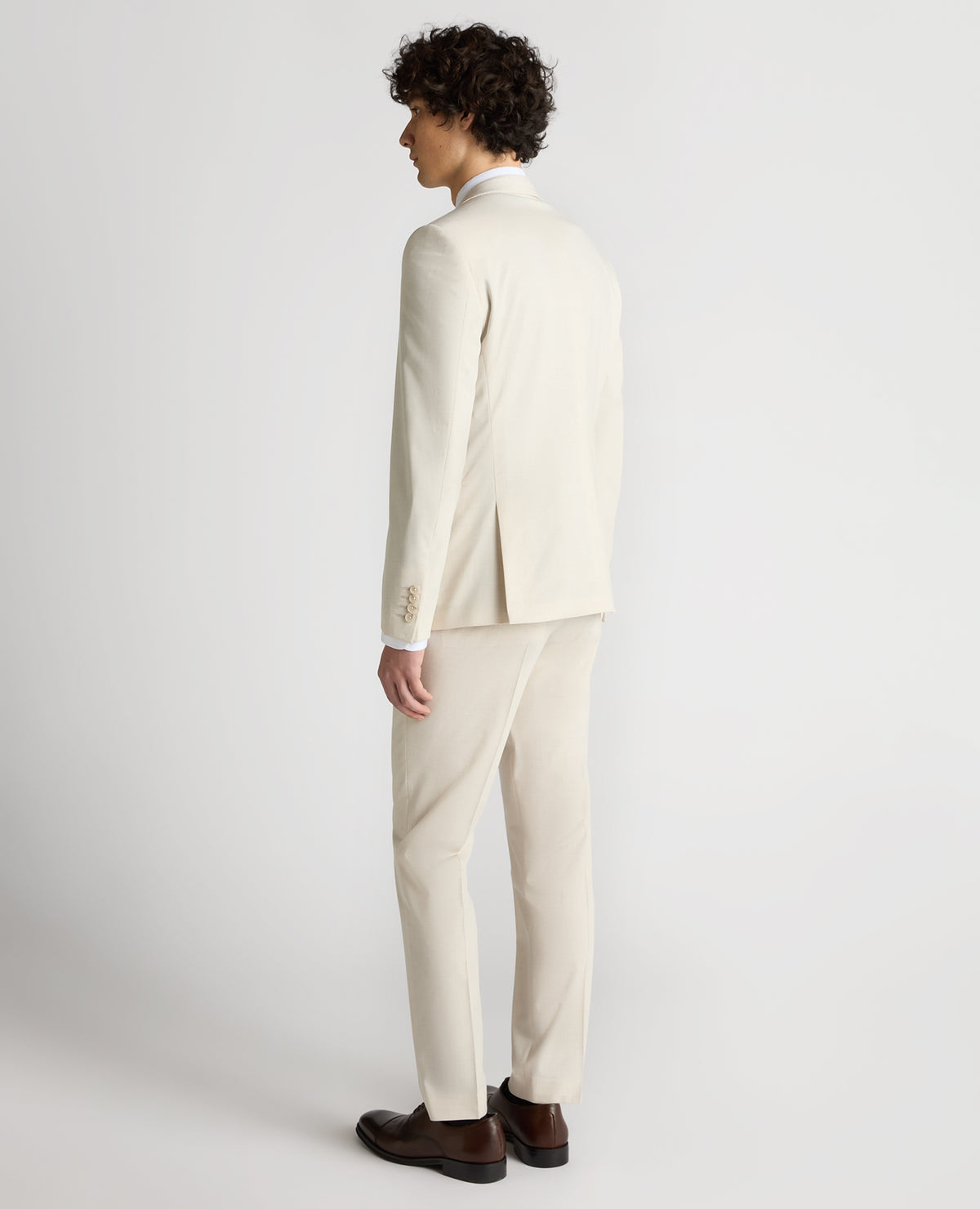 Man wearing a sand Slim Fit Stretch Suit