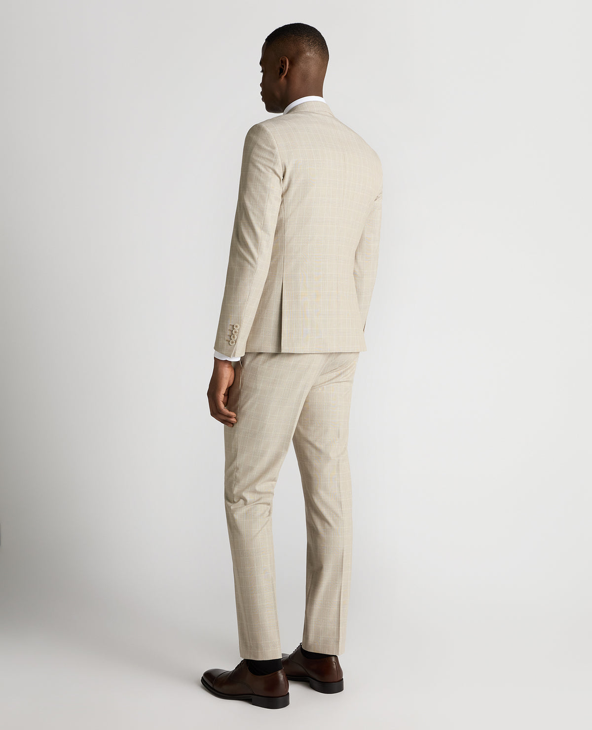 Man wearing a sand Slim Fit Checked Stretch Suit