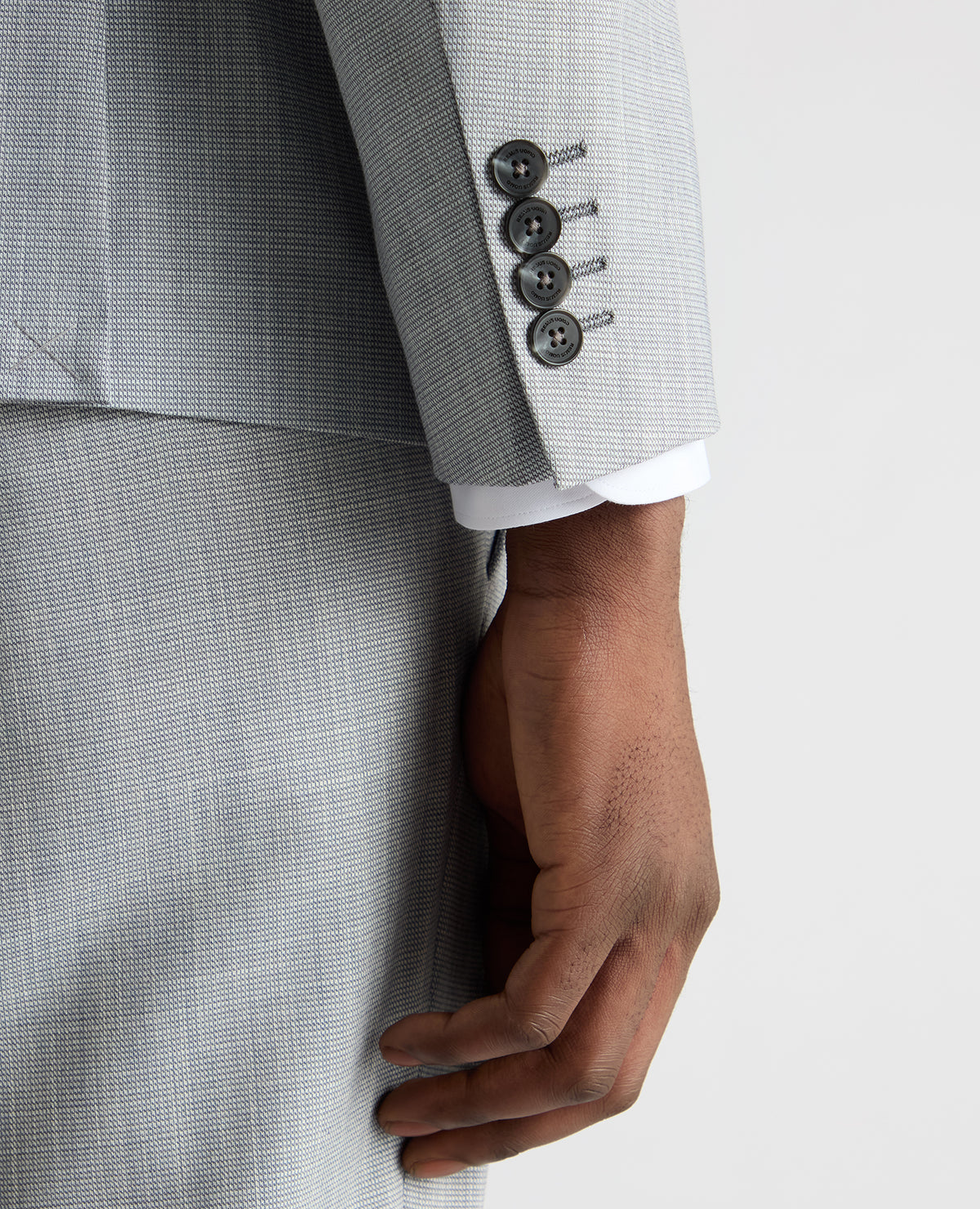 Man wearing a blue Slim Fit Micro Houndstooth Suit Jacket