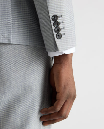 Man wearing a blue Slim Fit Micro Houndstooth Suit Jacket