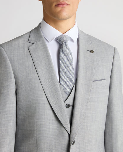 Man wearing a blue Tapered Fit Micro Houndstooth Suit Jacket