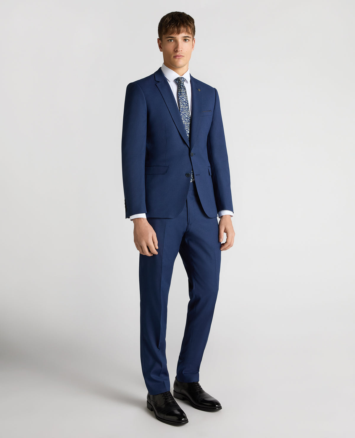 Man wearing a blue Slim Fit Micro Check Stretch Suit