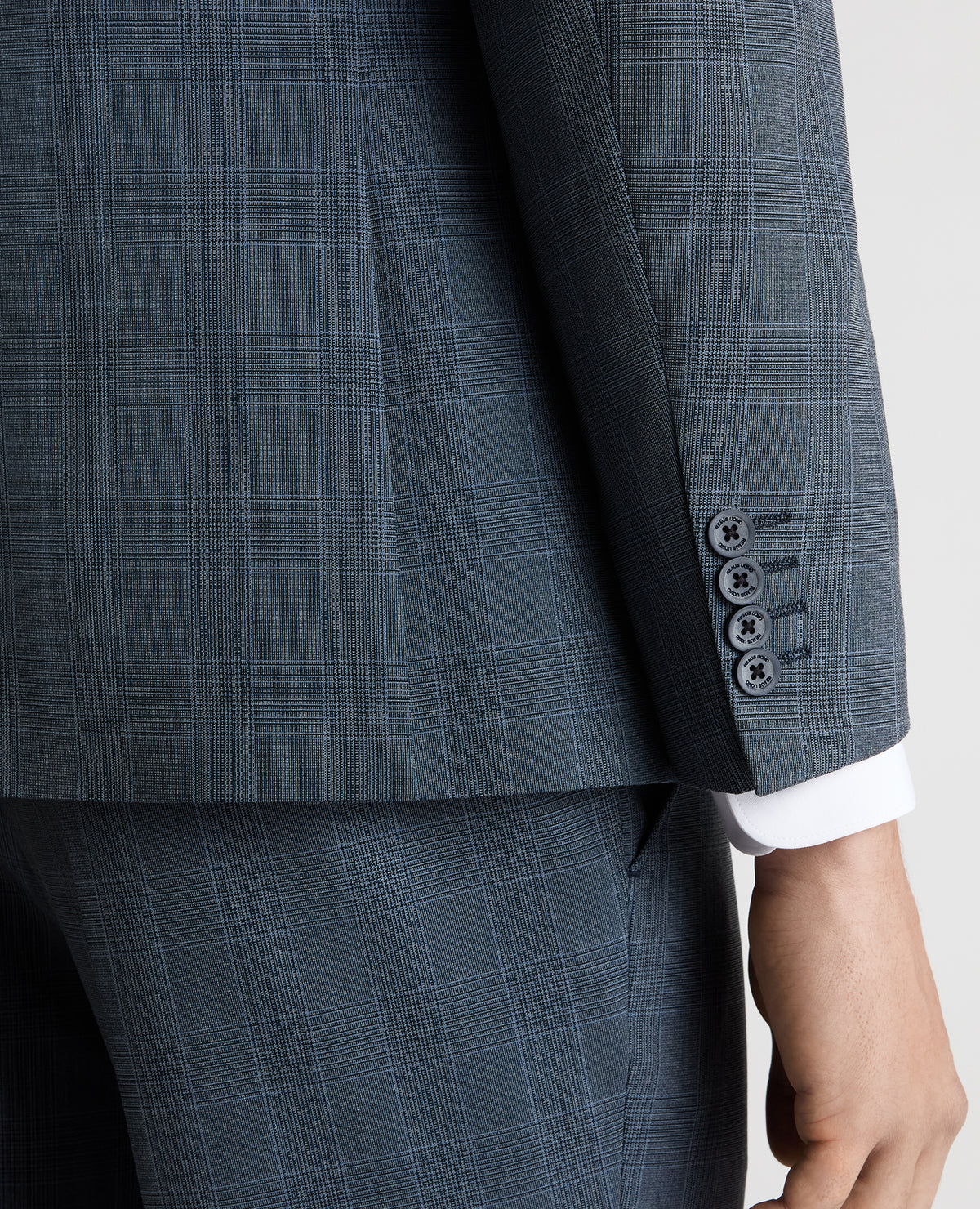 Man wearing a blue Tapered Fit Checked Stretch Suit Jacket