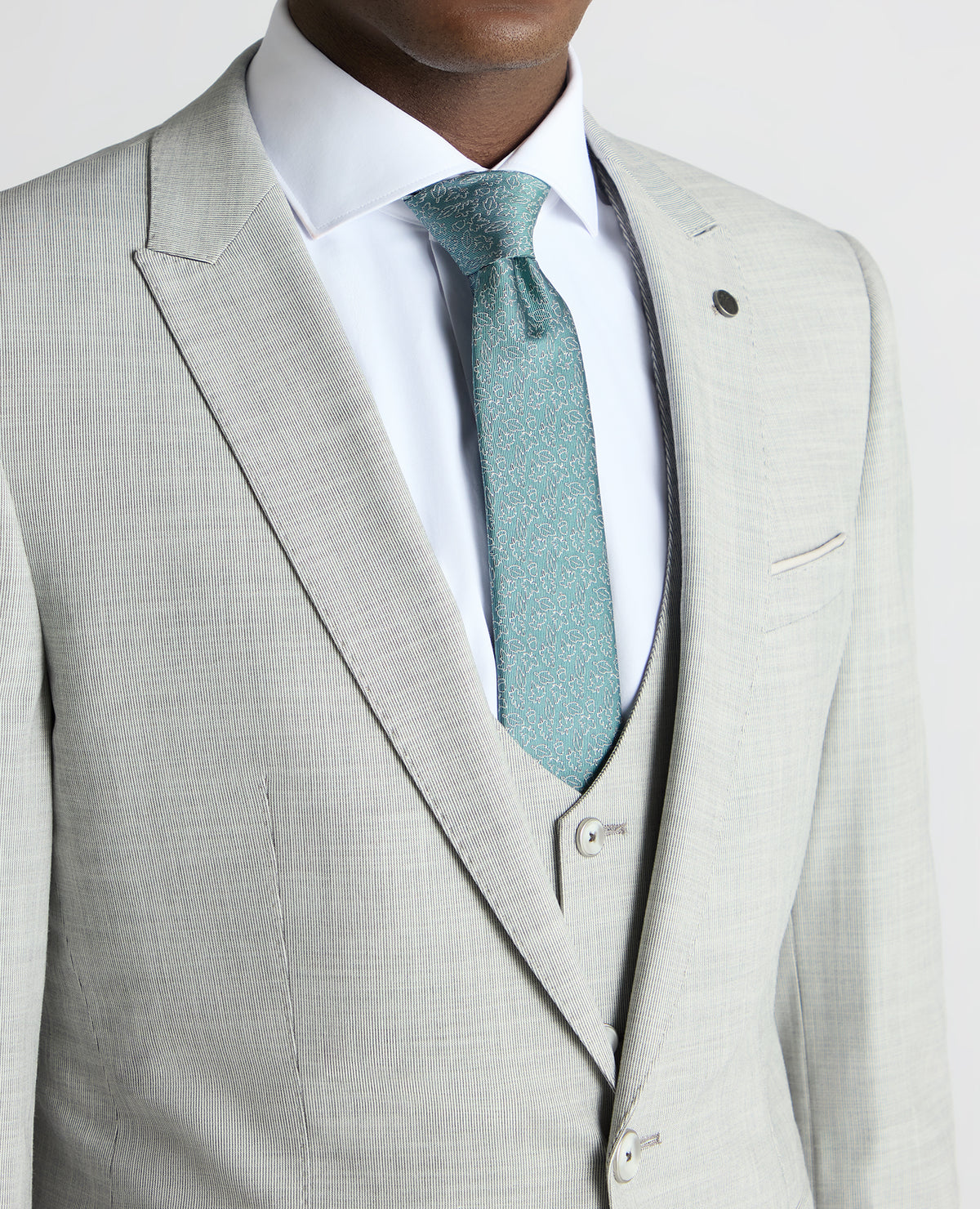 Man wearing a grey Slim Fit Stretch Micro Pinstripe Suit Jacket