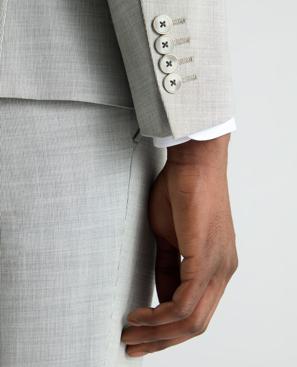 Man wearing a grey Slim Fit Stretch Micro Pinstripe Suit