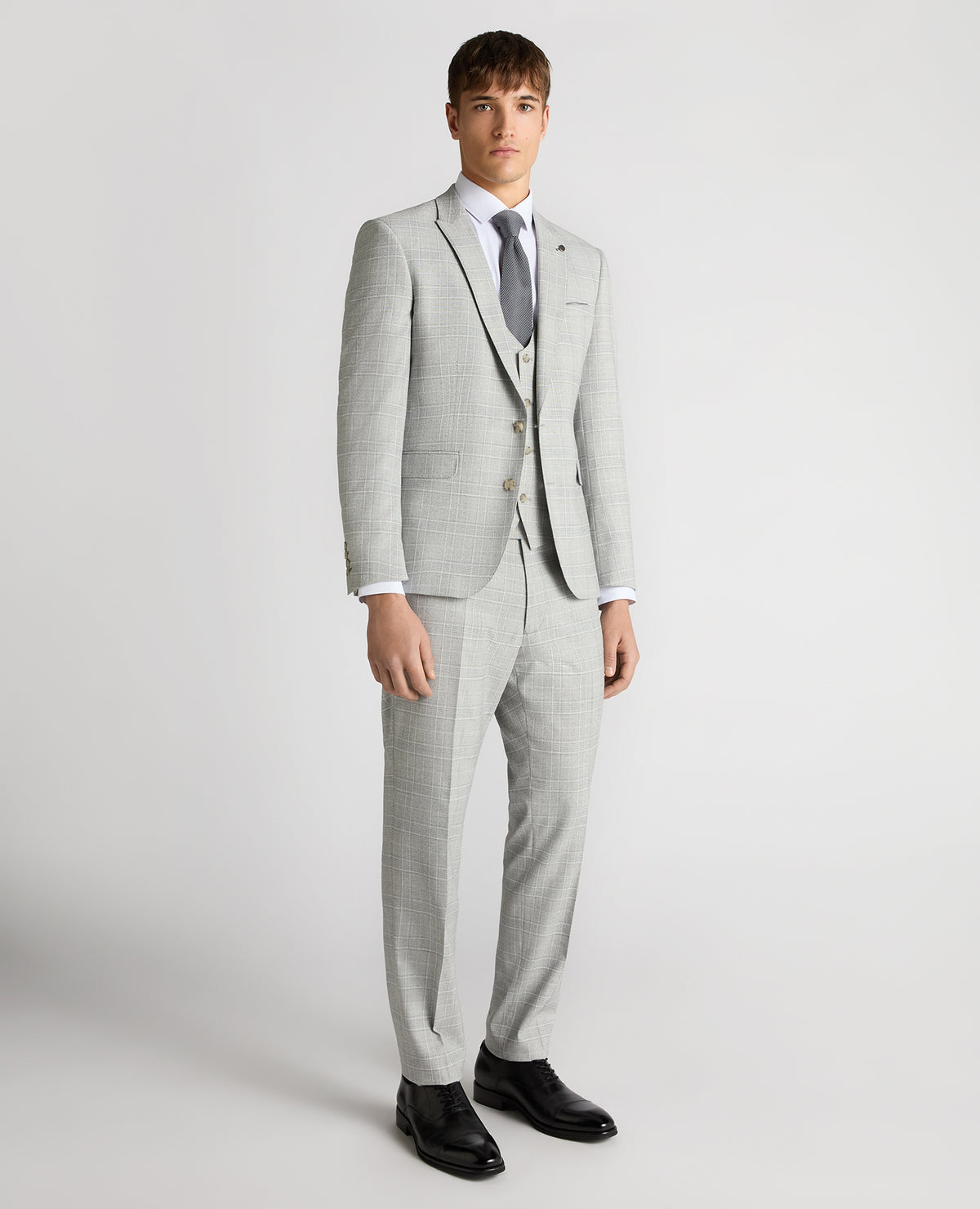 Man wearing a grey Slim Fit Checked Stretch Suit Jacket